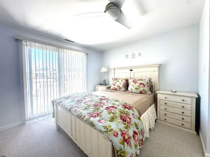 a bed room with a bed and a window