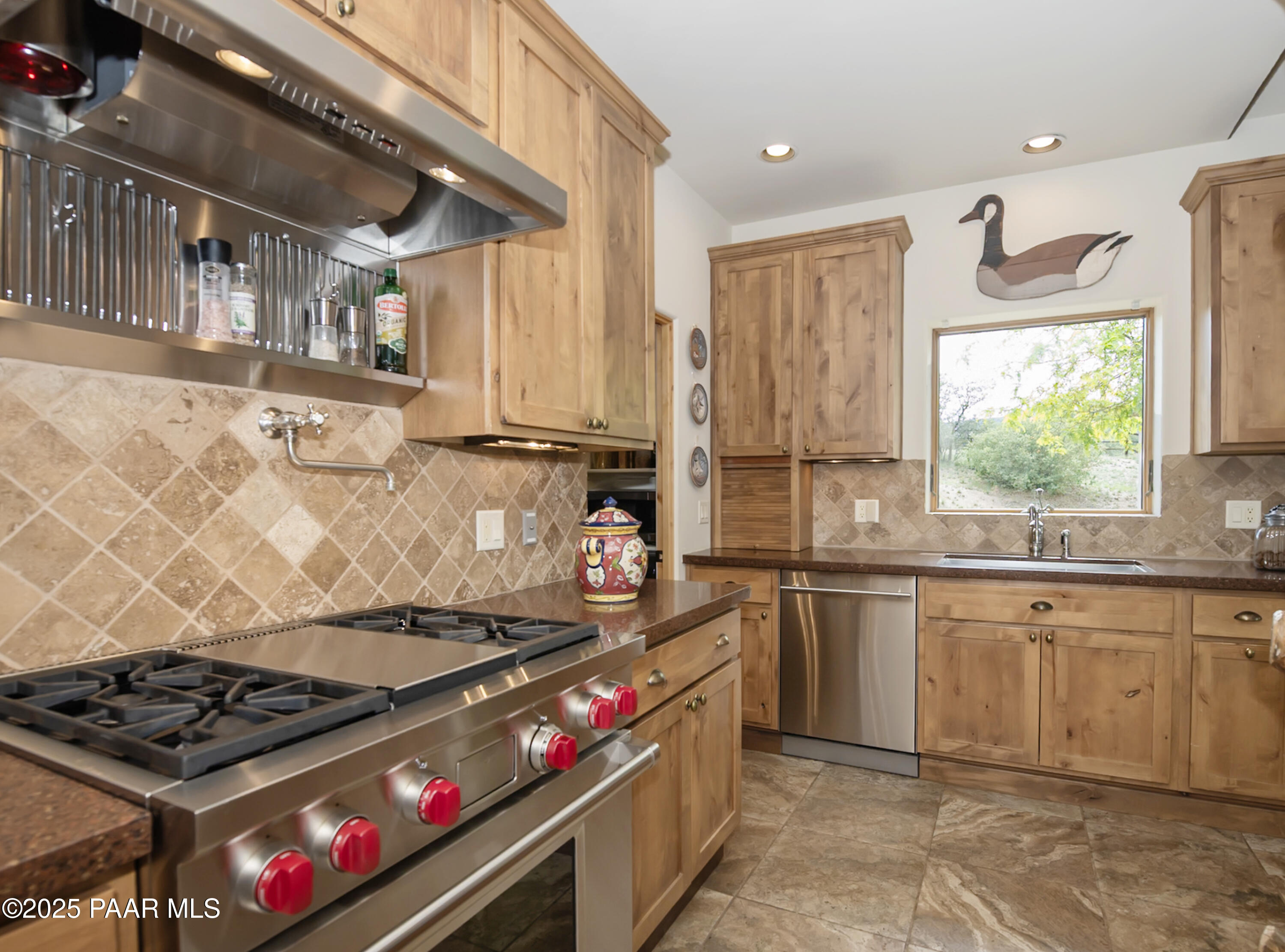 770 Grisby Road Skull Valley, AZ 86338 - Photo 8 of 58 a kitchen with stainless steel appliances granite countertop a stove and a sink