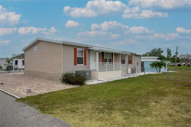 a view of house with yard and entertaining space