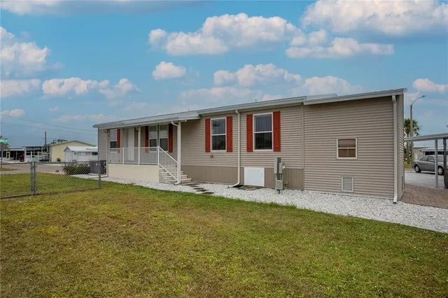 a house view with swimming pool and porch