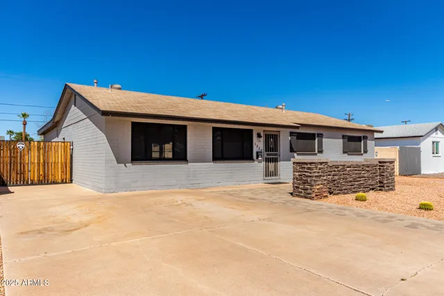 a front view of a house with a outdoor space