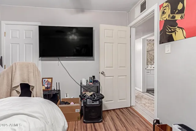 a view of a living room and a flat screen tv