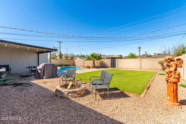a view of a chairs and table in patio