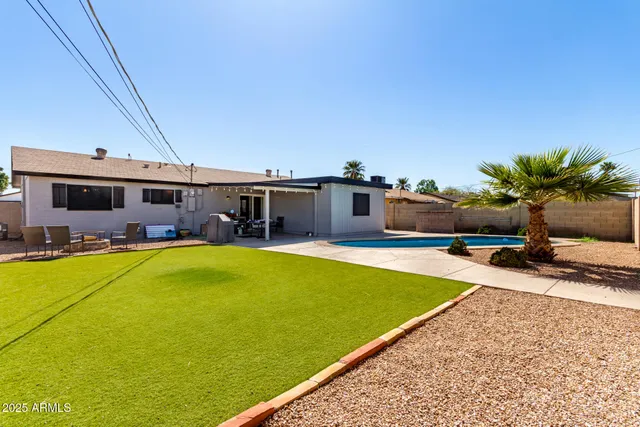 a view of a swimming pool with a lounge chairs