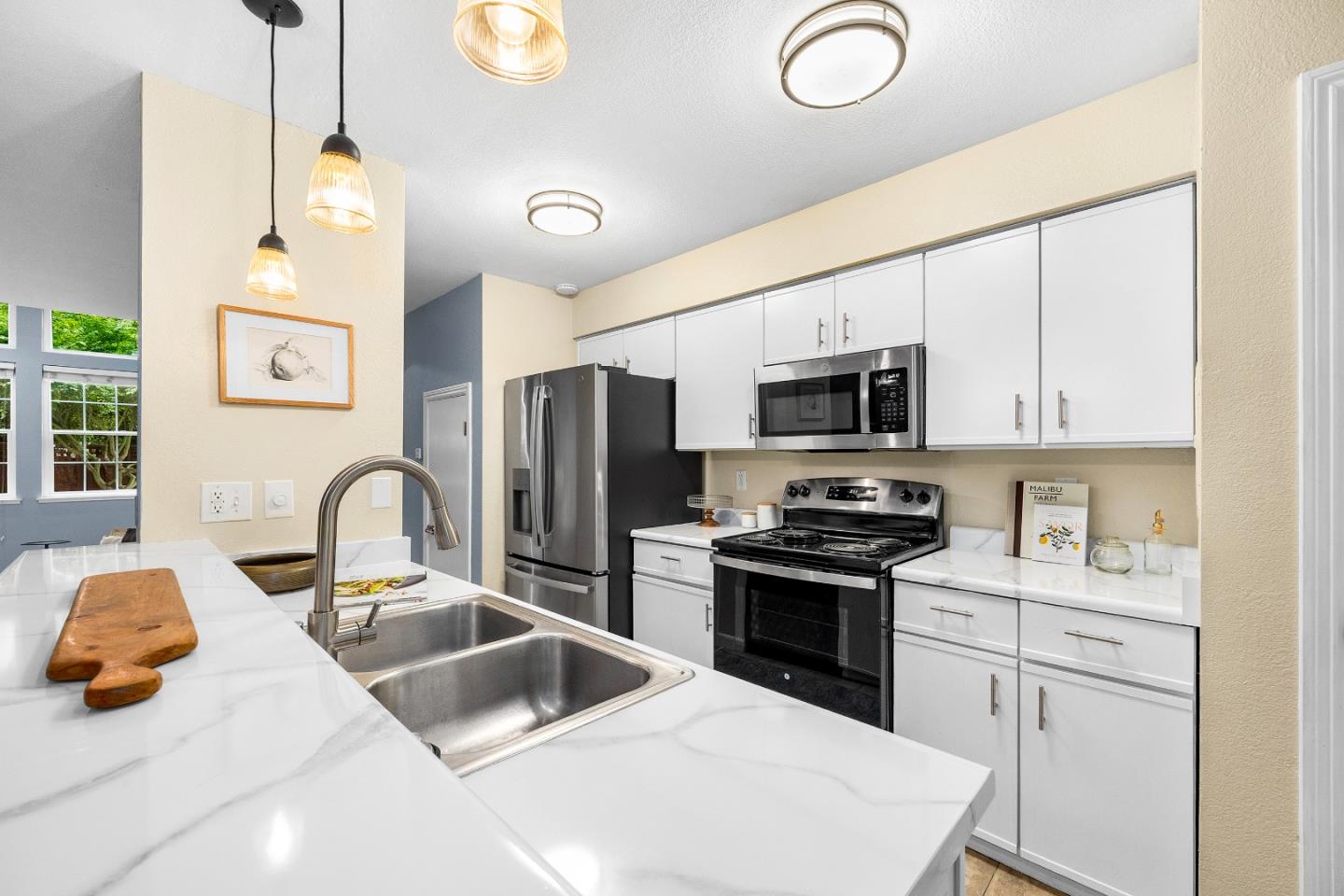 1644 Ocean Street Santa Cruz, CA 95060 - Photo 15 of 60 a kitchen with stainless steel appliances granite countertop a sink a stove cabinets and a refrigerator