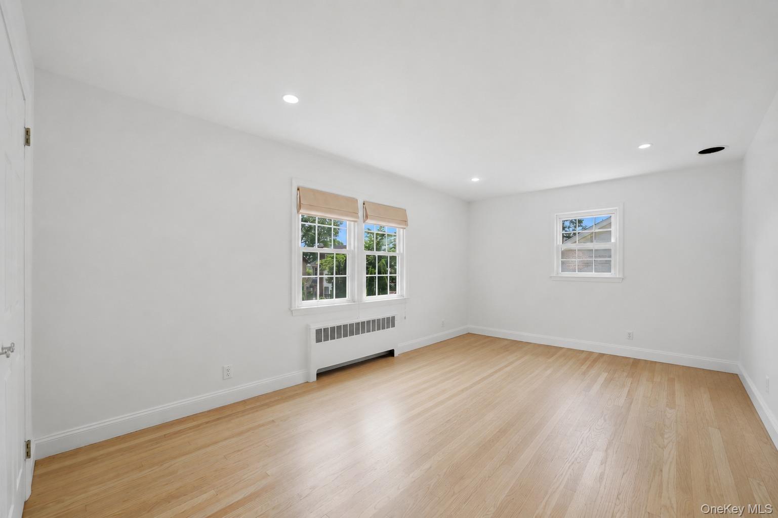 144 Bell Road Scarsdale, NY 10583 - Photo 21 of 49 Spacious room with light wood-finish flooring, white walls, and recessed lighting