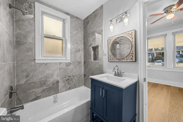 a bathroom with a sink a toilet and a bathtub