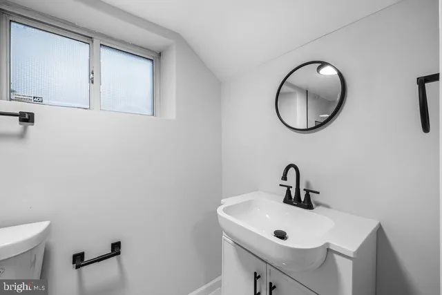 a bathroom with a shower and a toilet