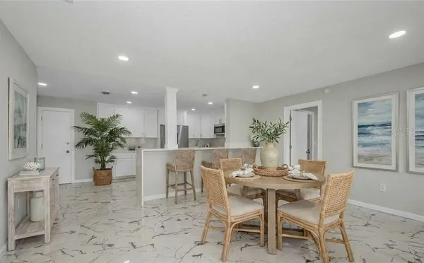 a sitting area with pier lake view and boat