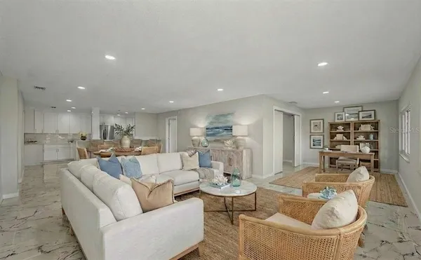 a view of a chairs and table in backyard of the house