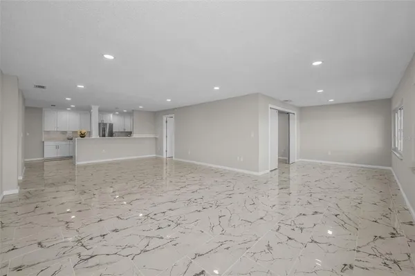 an aerial view of residential house with outdoor space and swimming pool