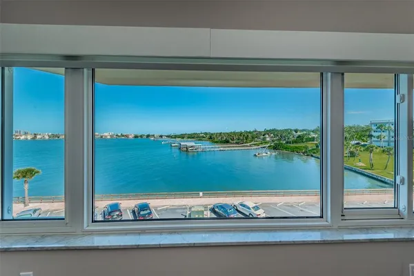 a view of a balcony with ocean view