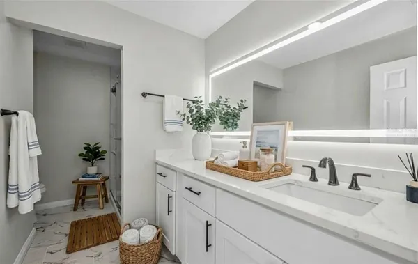 a room with lots of furniture and wooden floors