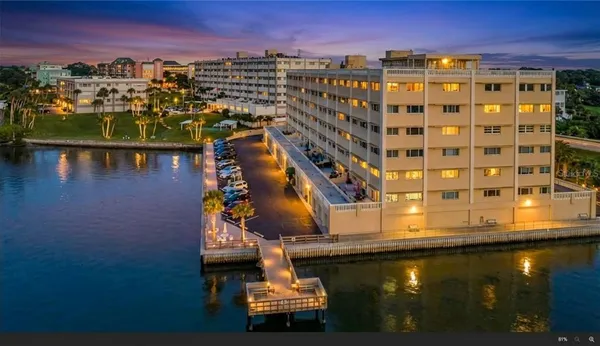 a kitchen with appliances a sink and cabinets