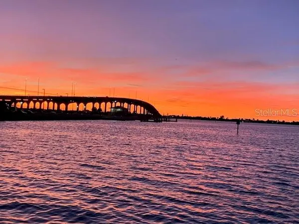 a kitchen with stainless steel appliances white cabinets and a refrigerator