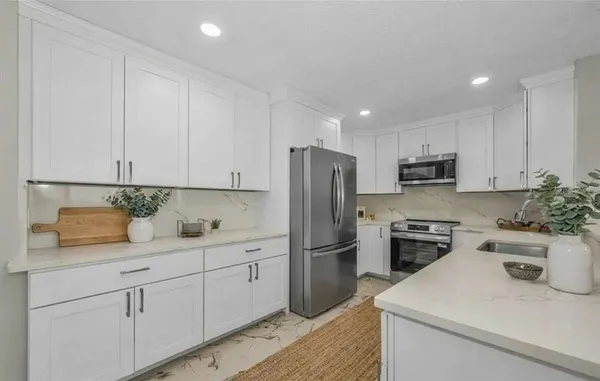 a view of kitchen with wooden floor