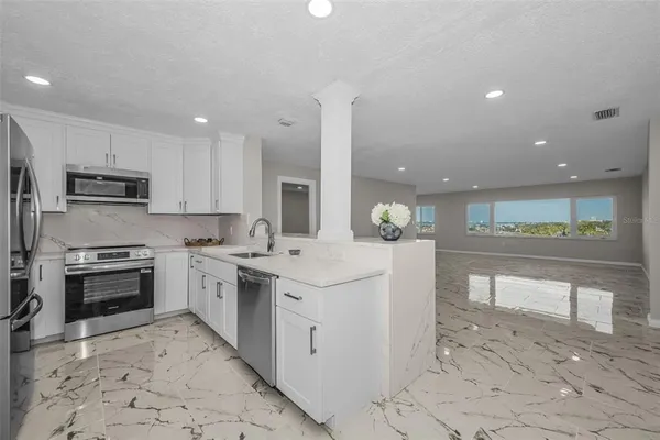 a bedroom with furniture and a window