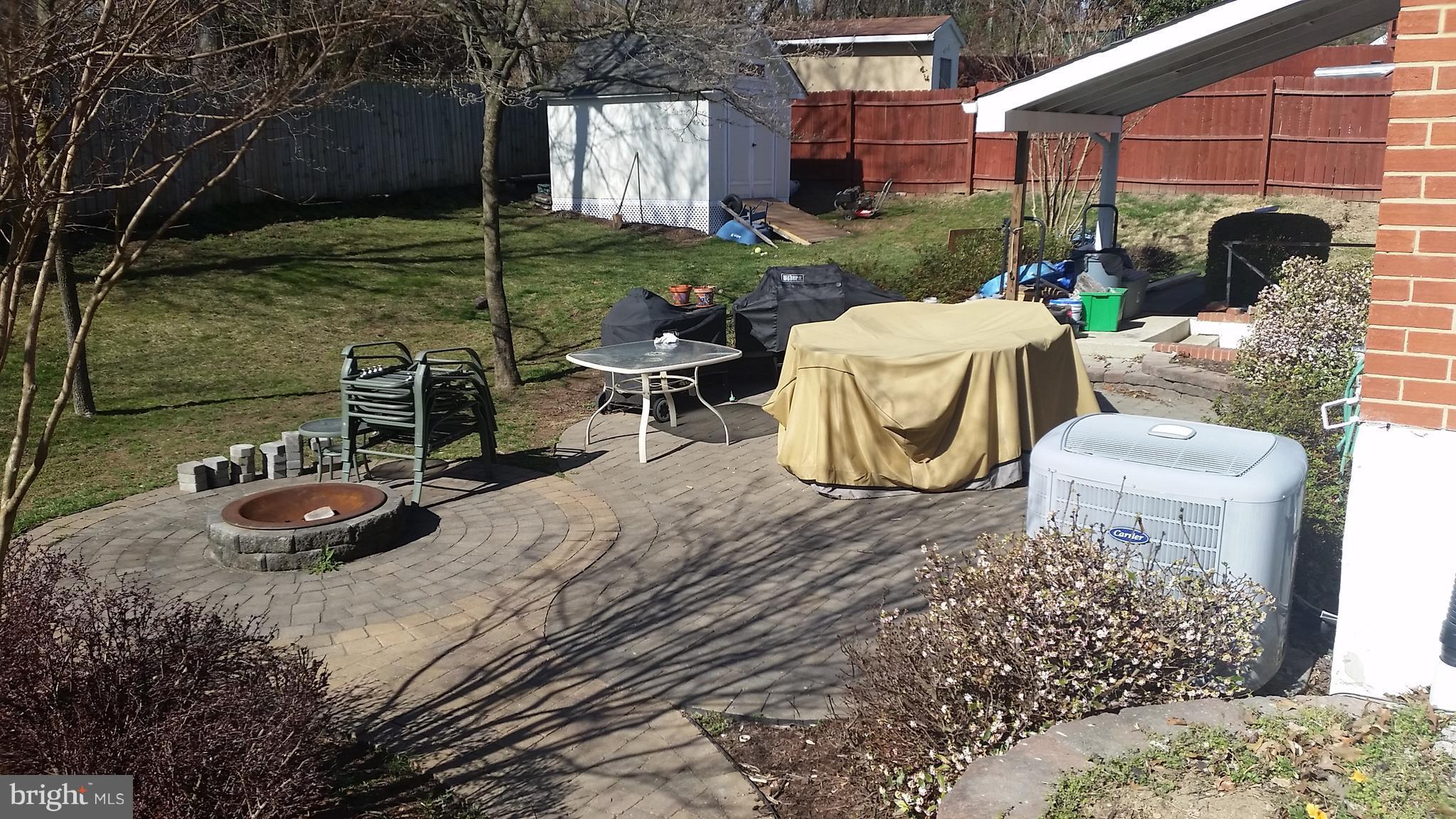14142 Grayson Road Woodbridge, VA 22191 - Photo 3 of 11 a view of a chairs and table in backyard