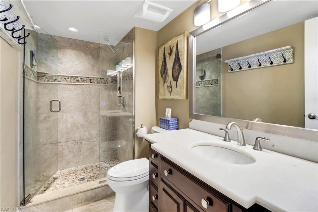 305 Goodlette Road South, Unit C302 Naples, FL 34102 - Photo 12 of 22 a bathroom with a sink toilet and shower