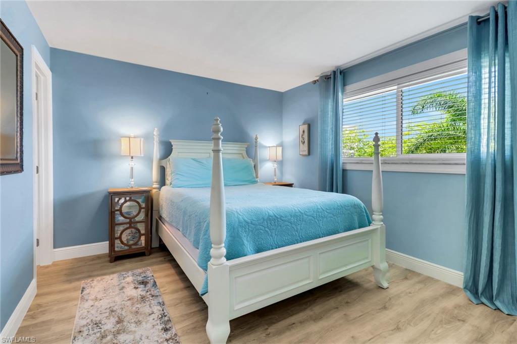 305 Goodlette Road South, Unit C302 Naples, FL 34102 - Photo 13 of 22 a bedroom with a bed and a window