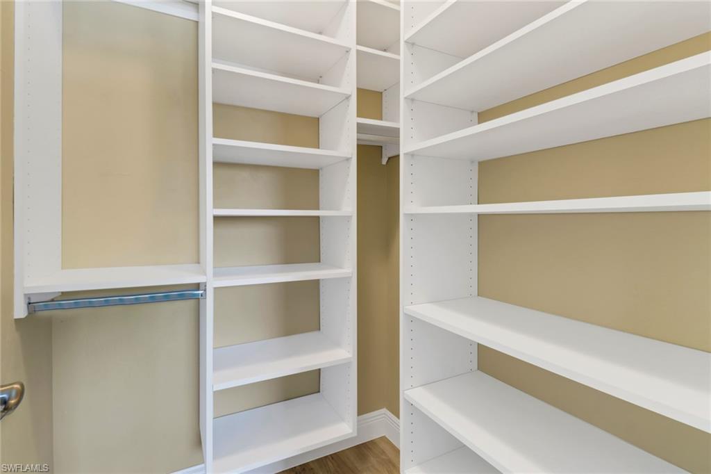 305 Goodlette Road South, Unit C302 Naples, FL 34102 - Photo 14 of 22 a view of walk in closet with empty racks