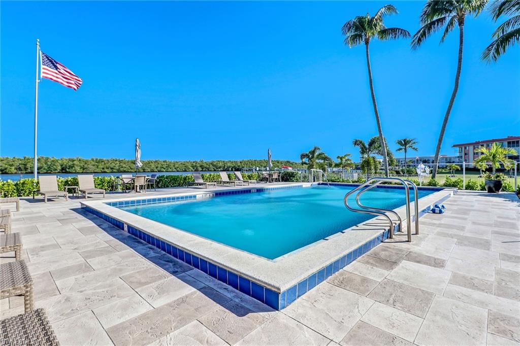 305 Goodlette Road South, Unit C302 Naples, FL 34102 - Photo 18 of 22 a view of a swimming pool and a terrace