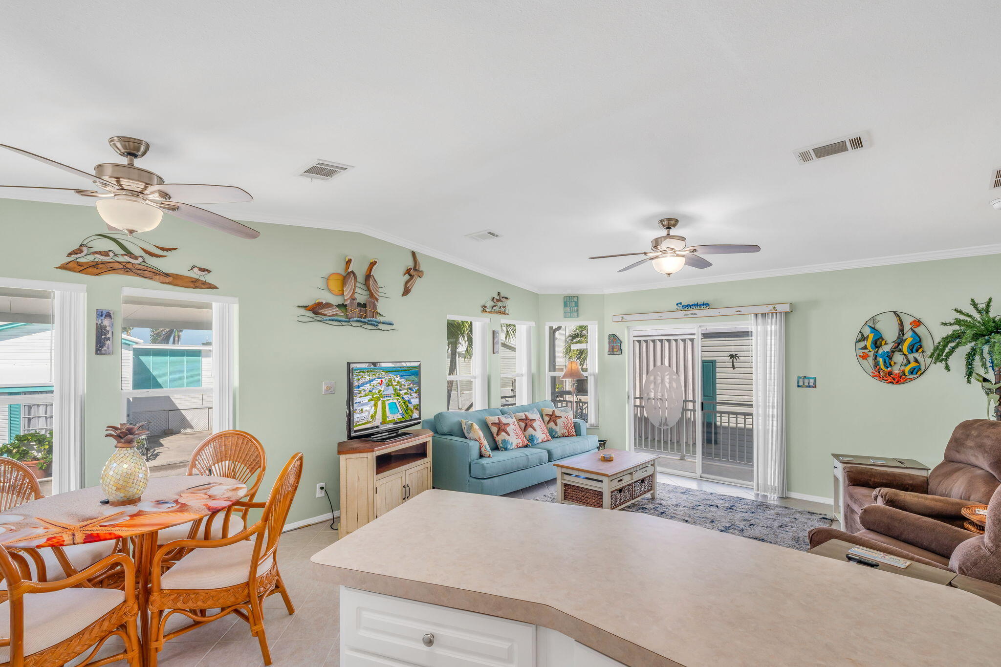 55 Boca Chica Road, Unit 447 Key West, FL 33040 - Photo 51 of 51 a living room with furniture and a chandelier