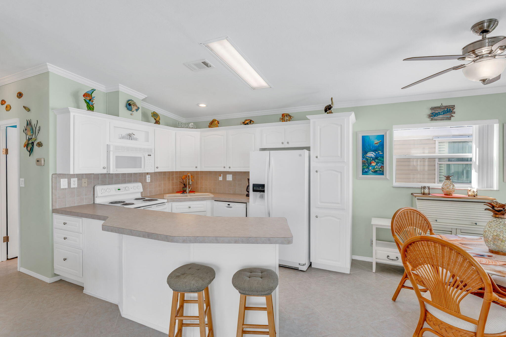 55 Boca Chica Road, Unit 447 Key West, FL 33040 - Photo 5 of 51 a view of kitchen island with furniture and wooden floor