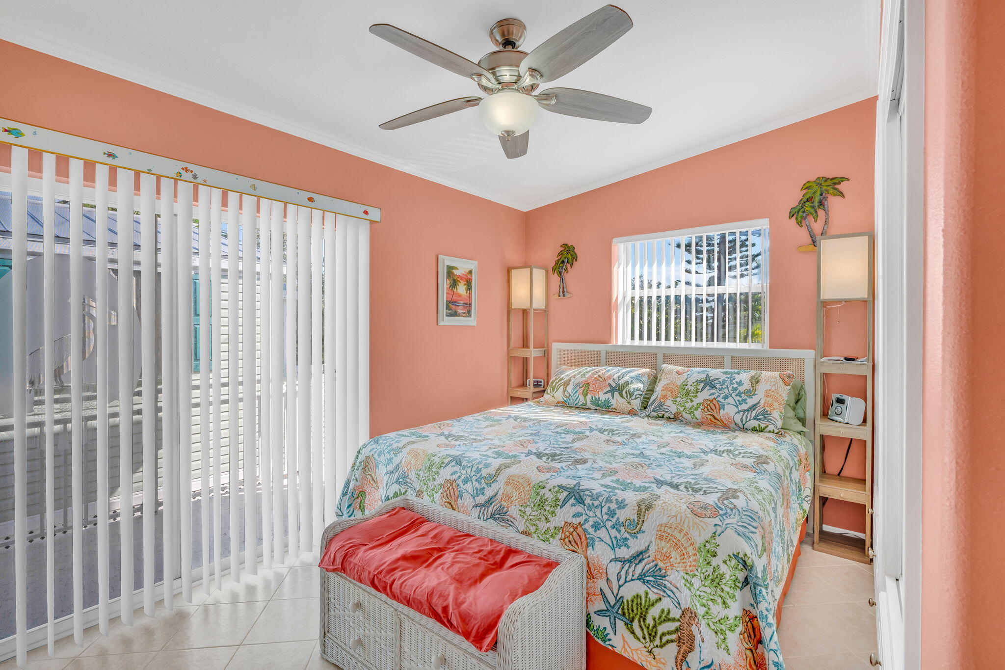55 Boca Chica Road, Unit 447 Key West, FL 33040 - Photo 7 of 51 a bedroom with a bed and a chandelier