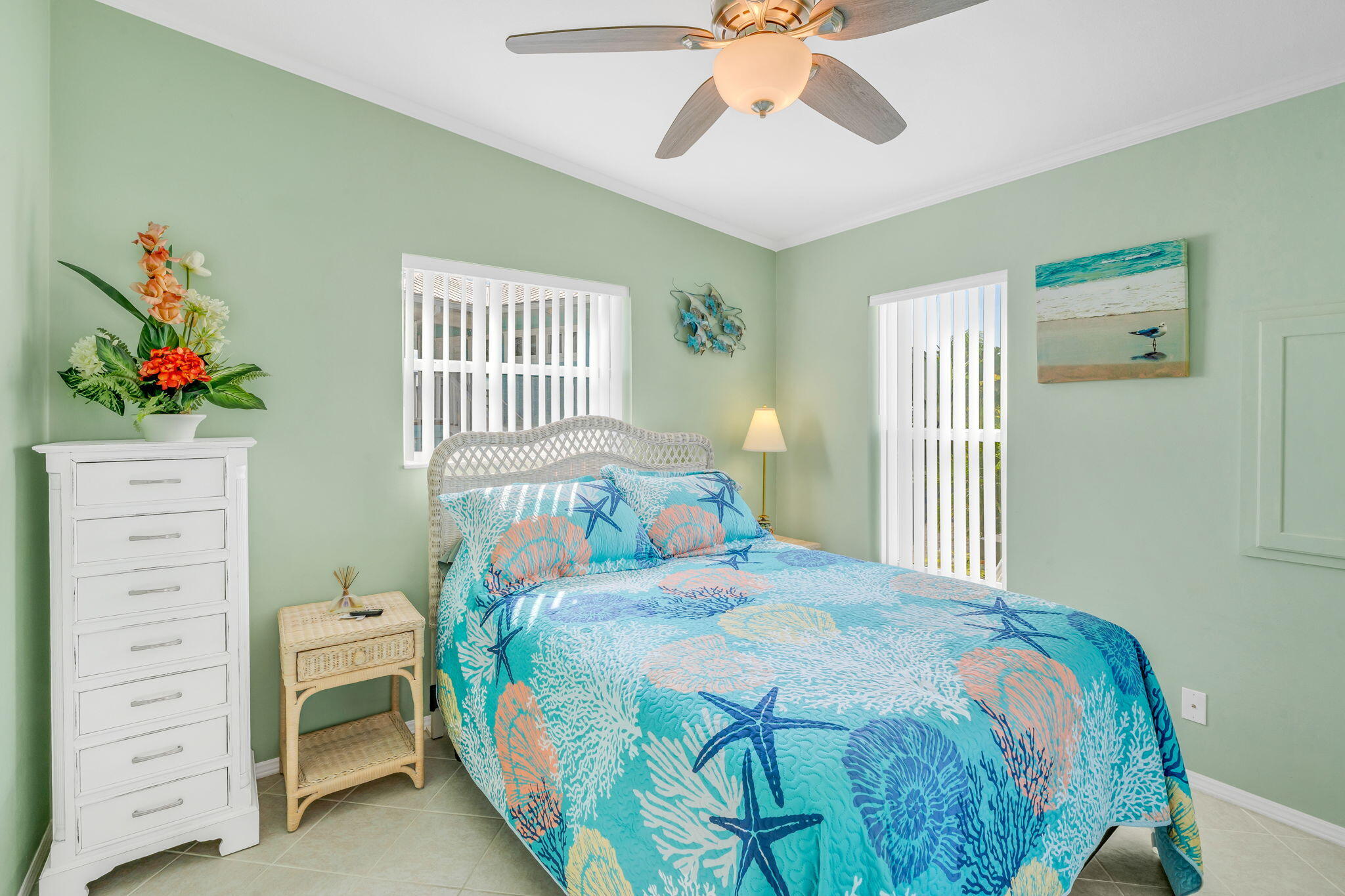 55 Boca Chica Road, Unit 447 Key West, FL 33040 - Photo 11 of 51 a bedroom with a bed and a chandelier