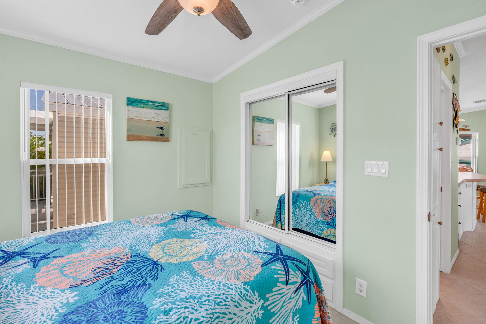 55 Boca Chica Road, Unit 447 Key West, FL 33040 - Photo 12 of 51 a bedroom with a bed and a chandelier
