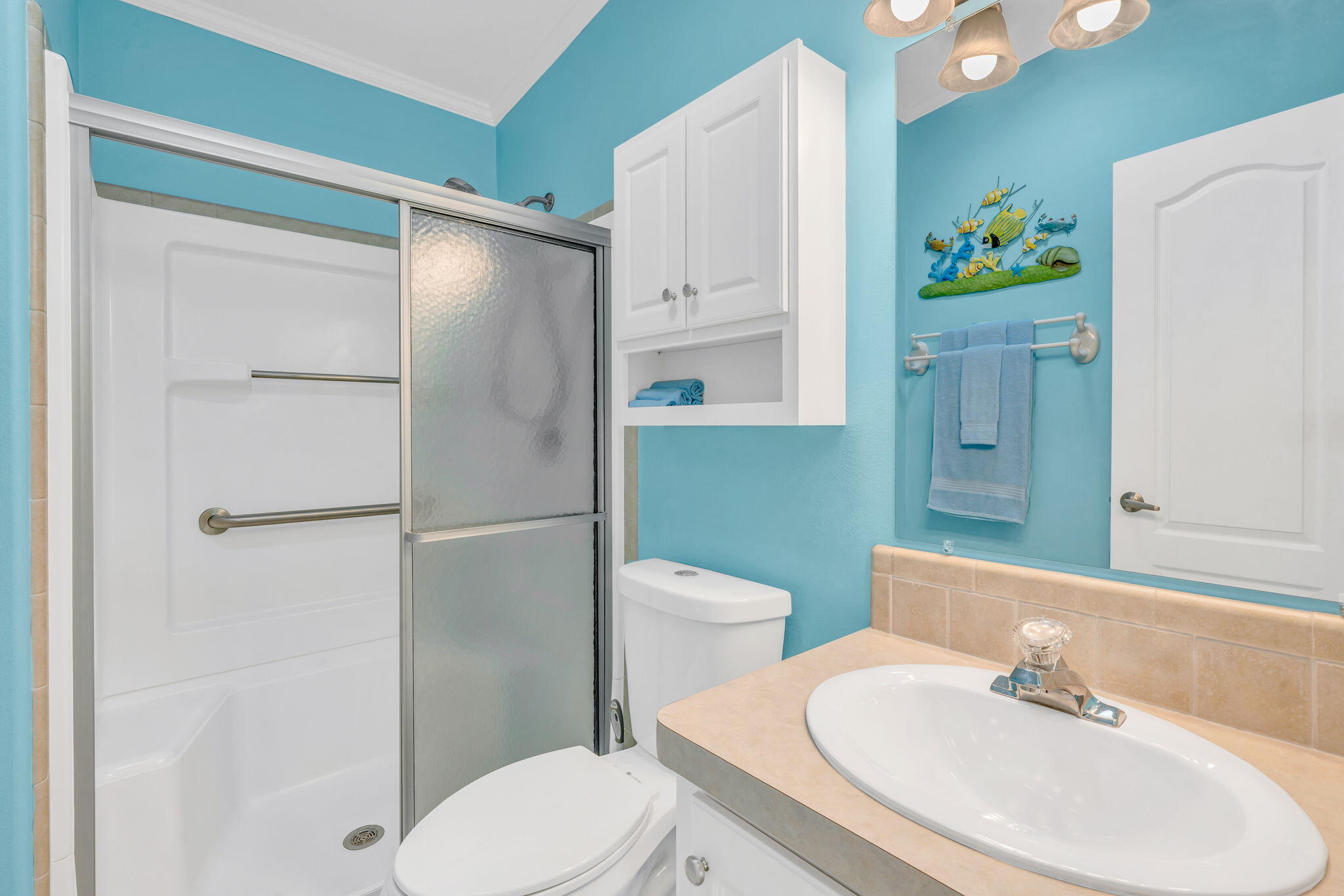 55 Boca Chica Road, Unit 447 Key West, FL 33040 - Photo 13 of 51 a white toilet sitting next to a bathroom sink