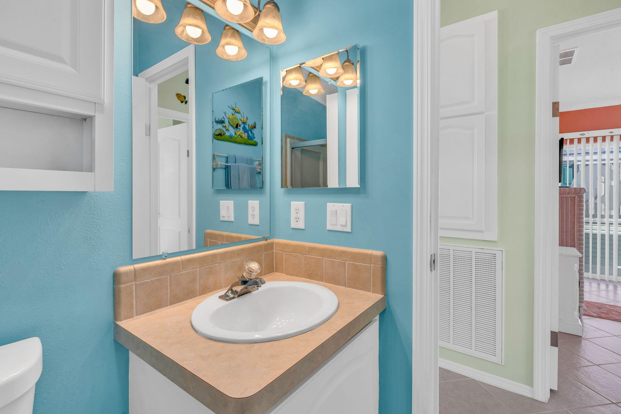 55 Boca Chica Road, Unit 447 Key West, FL 33040 - Photo 14 of 51 a bathroom with a sink and a mirror