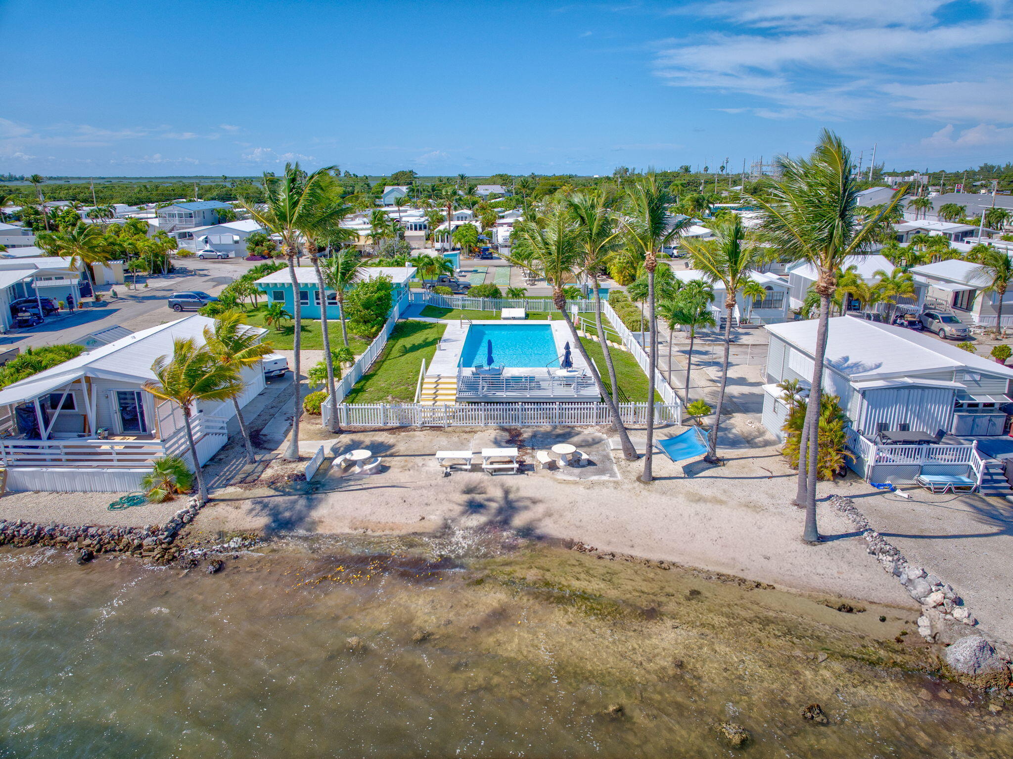 55 Boca Chica Road, Unit 447 Key West, FL 33040 - Photo 27 of 51 a view of outdoor space with seating area and car parked
