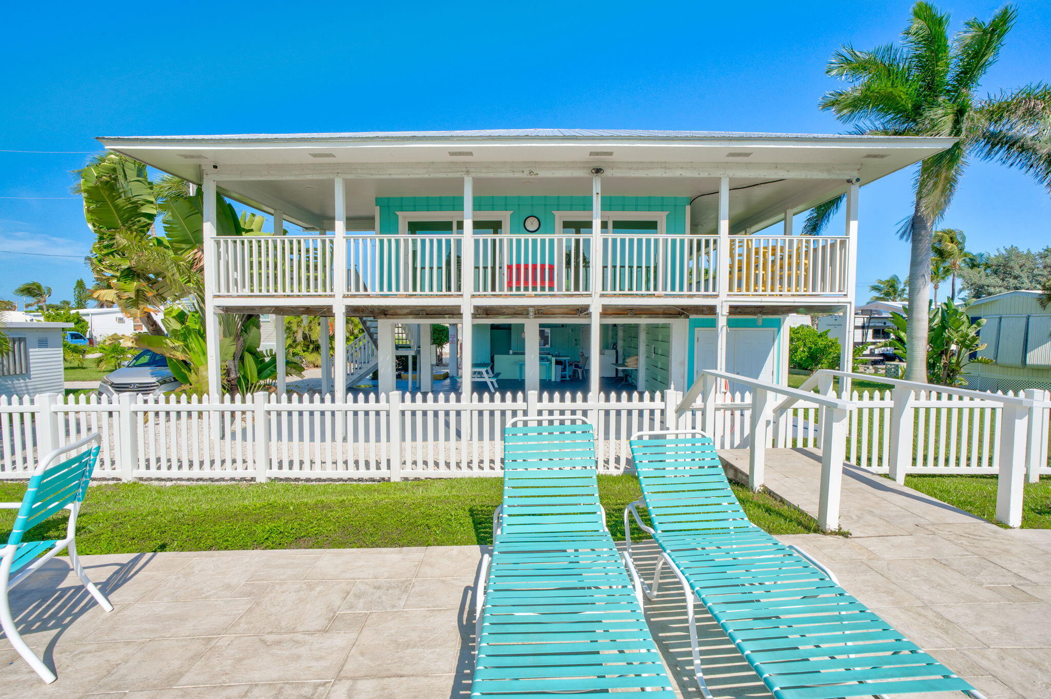 55 Boca Chica Road, Unit 447 Key West, FL 33040 - Photo 31 of 51 a view of a deck with a floor to ceiling window and wooden fence