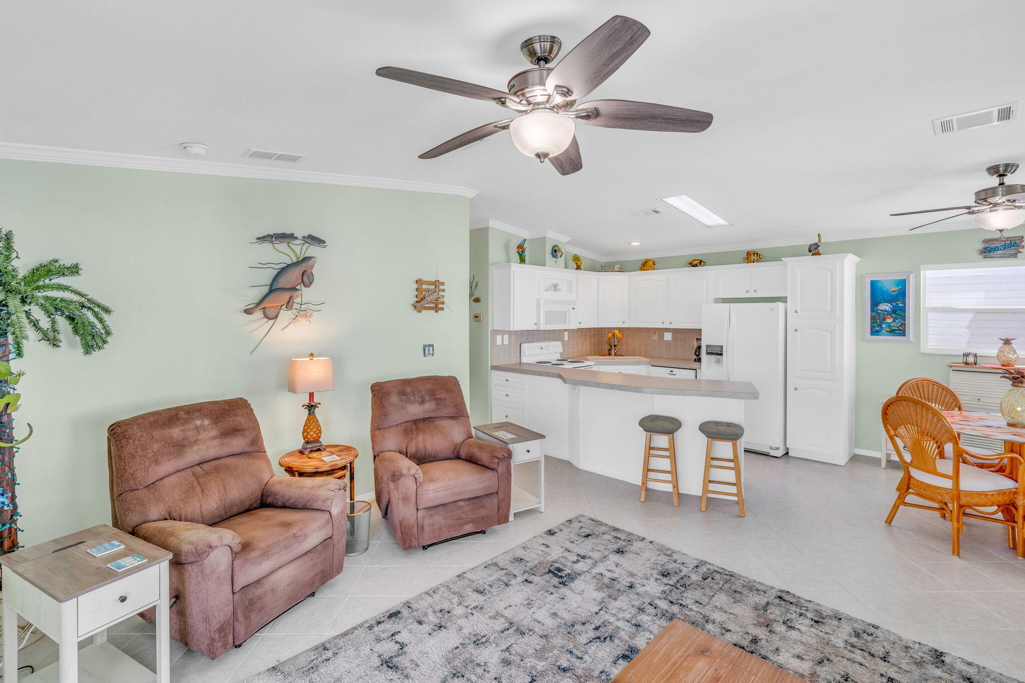 55 Boca Chica Road, Unit 447 Key West, FL 33040 - Photo 47 of 51 a living room with furniture and a chair