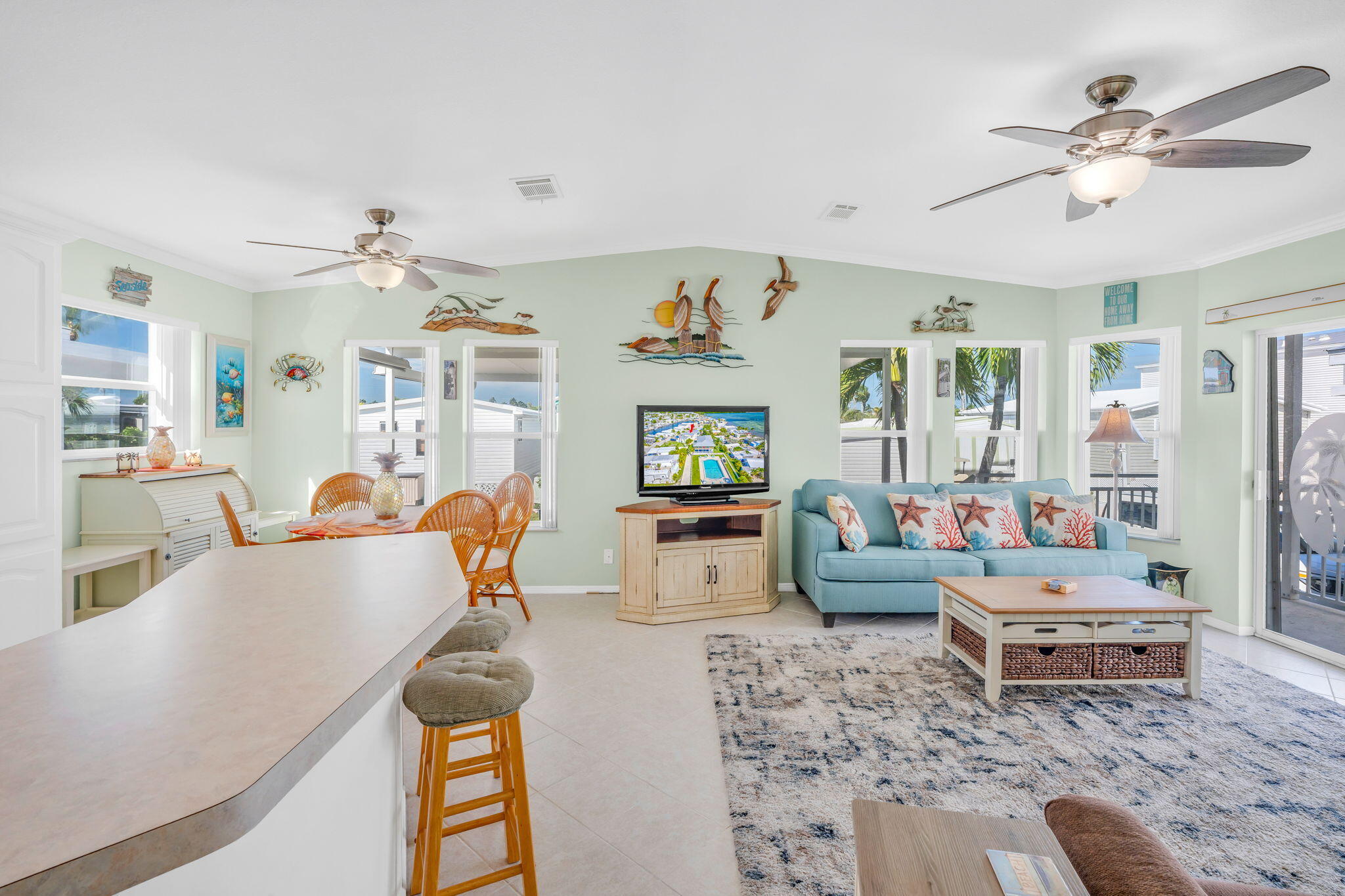 55 Boca Chica Road, Unit 447 Key West, FL 33040 - Photo 48 of 51 a living room with furniture and a chandelier