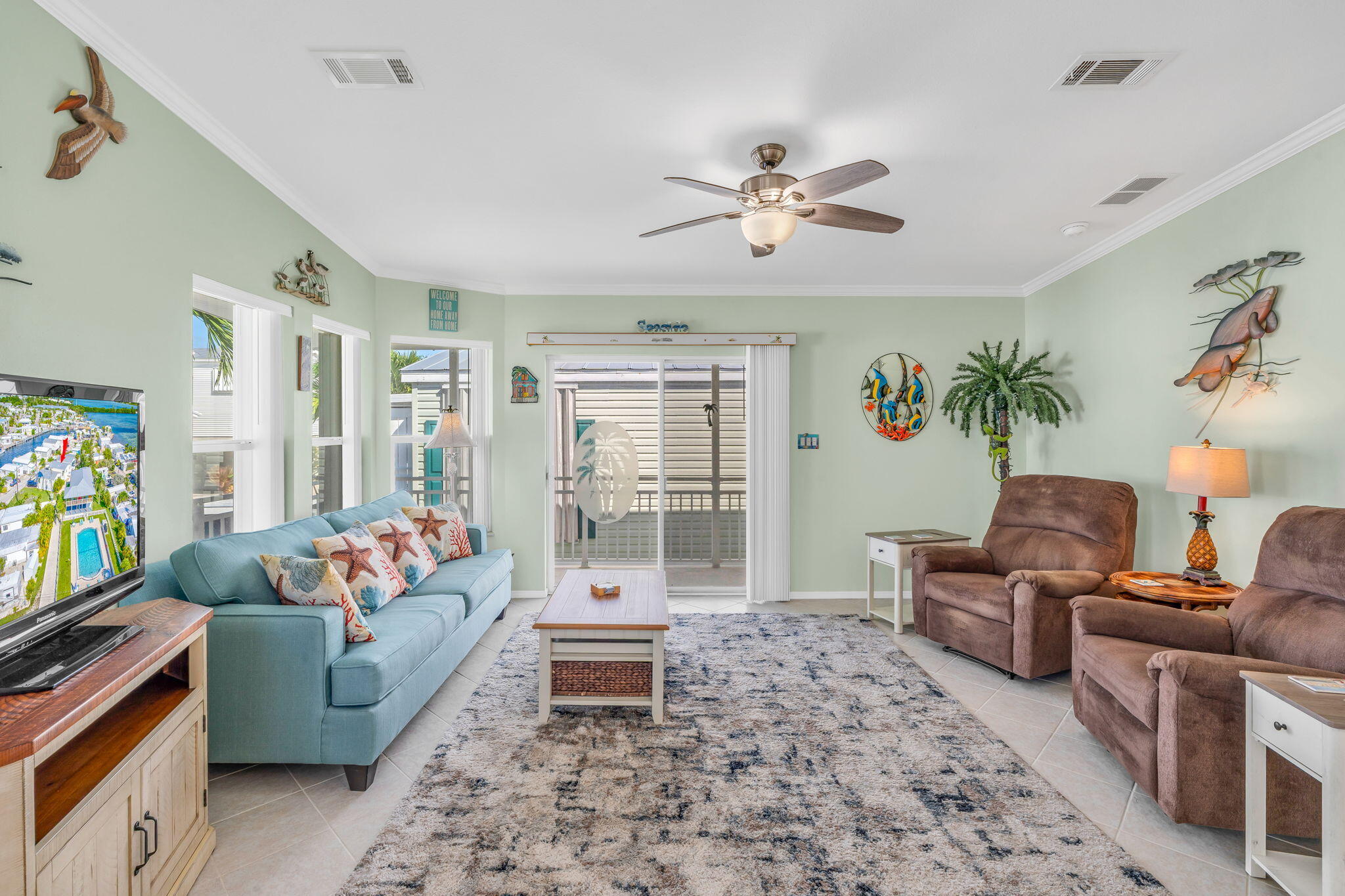 55 Boca Chica Road, Unit 447 Key West, FL 33040 - Photo 50 of 51 a living room with furniture and a flat screen tv