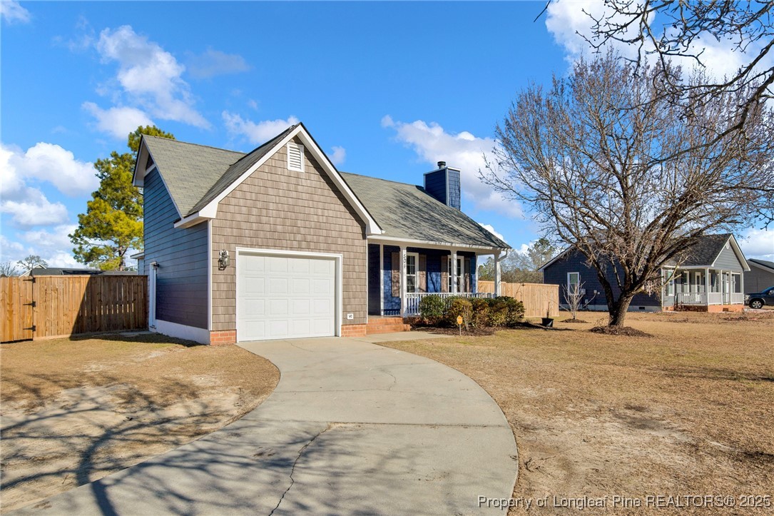 501 Camden Road Raeford, NC 28376 - Photo 2 of 35 a view of a house with a yard covered in snow