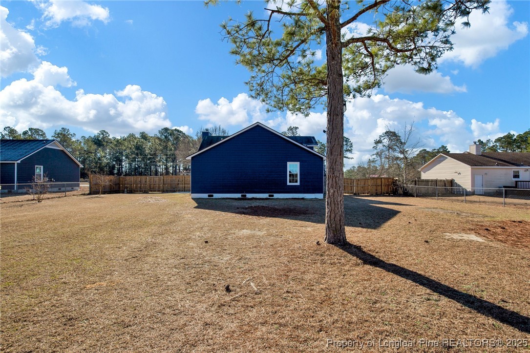 501 Camden Road Raeford, NC 28376 - Photo 32 of 35 a view of a house with a yard