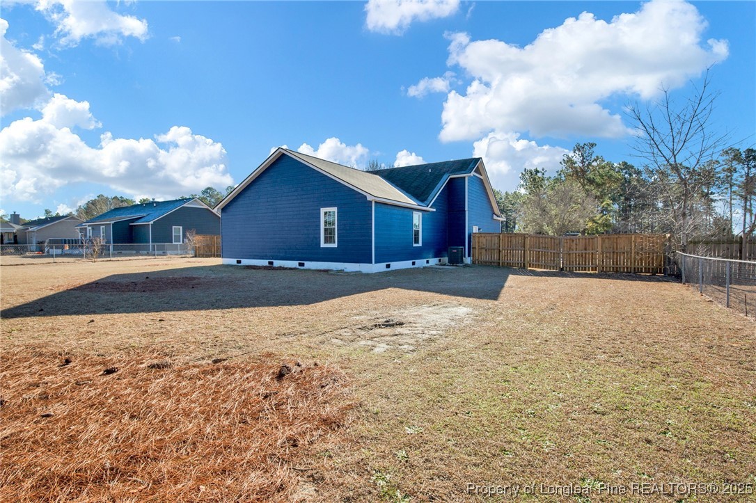 501 Camden Road Raeford, NC 28376 - Photo 33 of 35 a view of a house with a yard