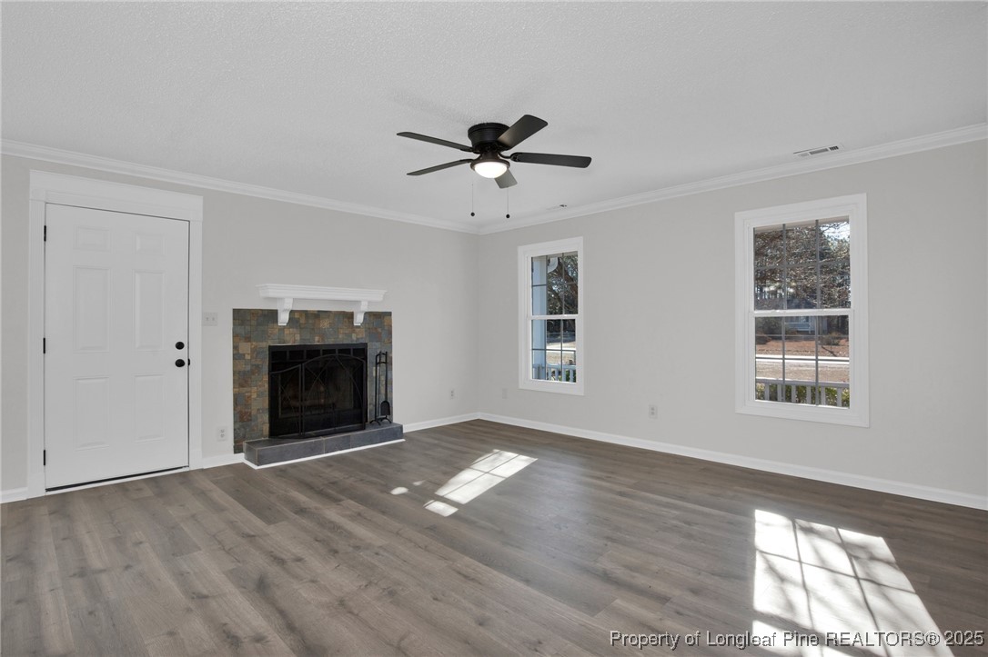 501 Camden Road Raeford, NC 28376 - Photo 6 of 35 a view of empty room with wooden floor and fan