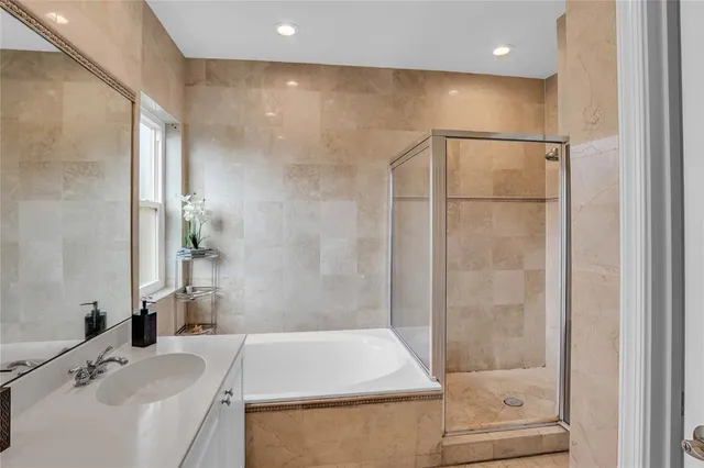 a bathroom with a tub and a sink
