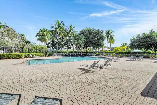 a view of outdoor space with playground and green space