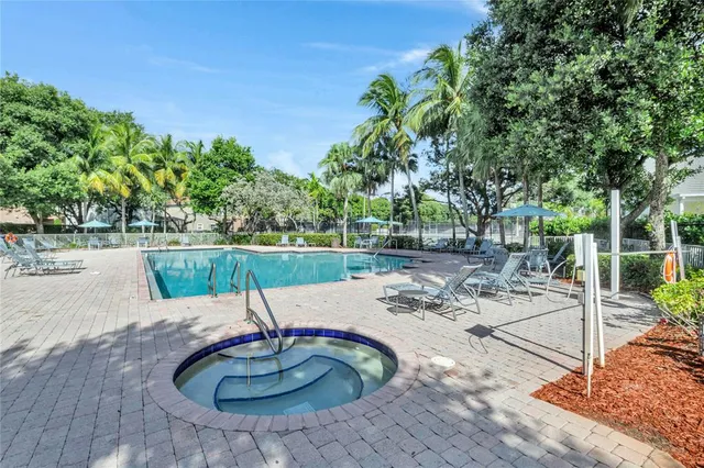 a view of a swimming pool with a patio