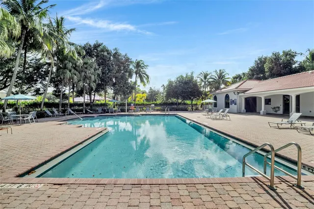 swimming pool view with a outdoor seating