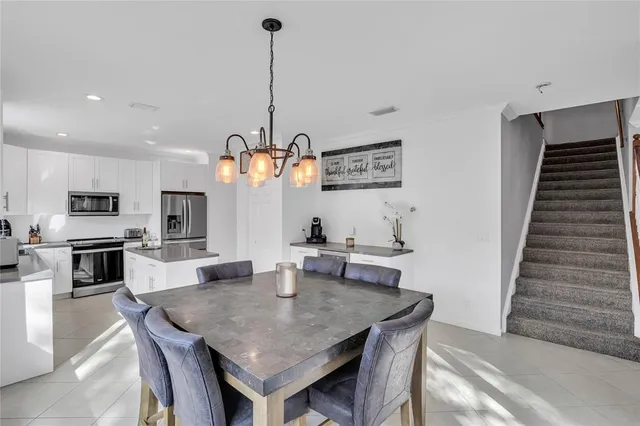 a view of a dining room and a table and chairs