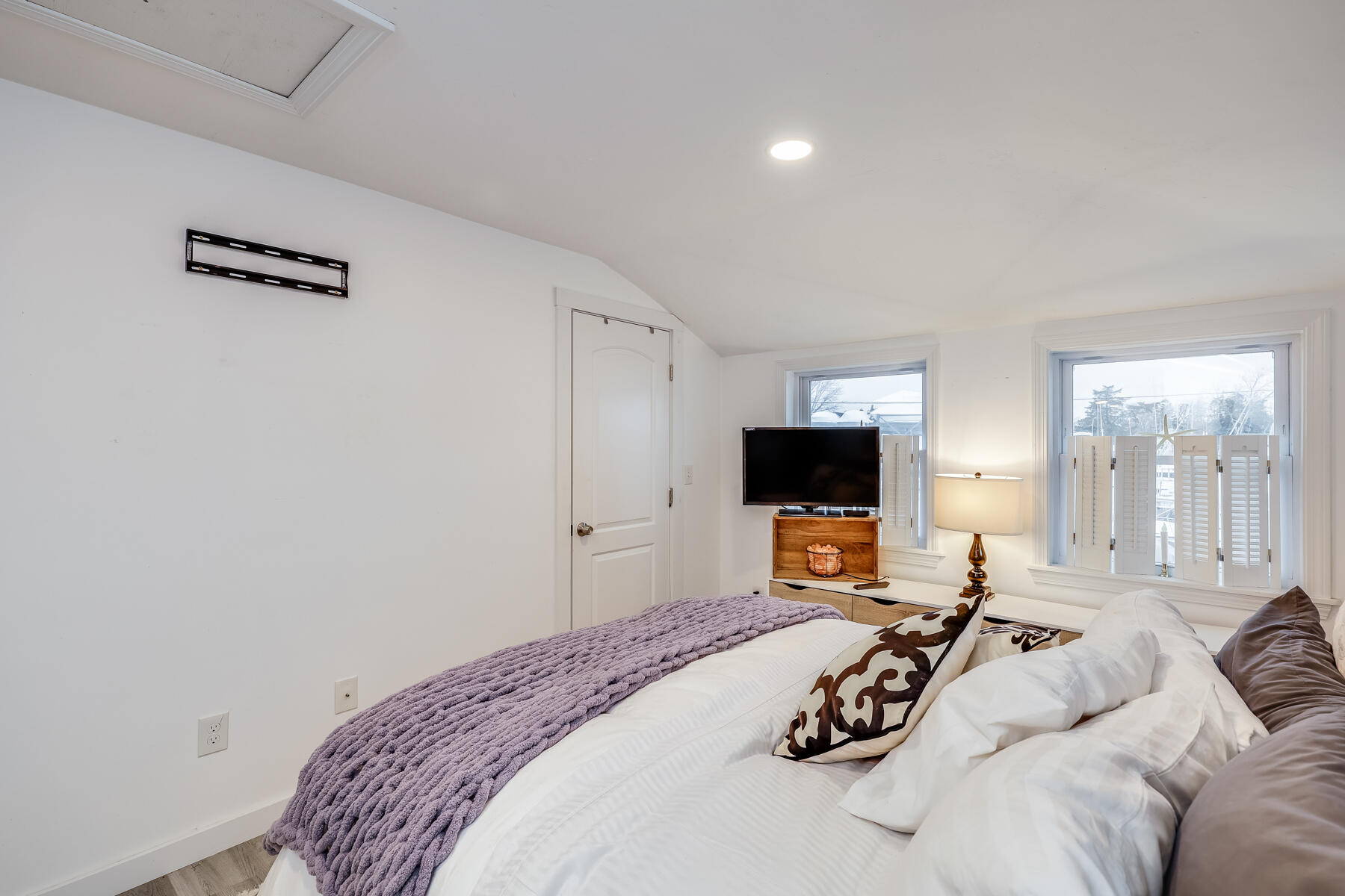 8 Green Street Buzzards Bay, MA 02532 - Photo 22 of 50 a bedroom with a bed and a flat screen tv