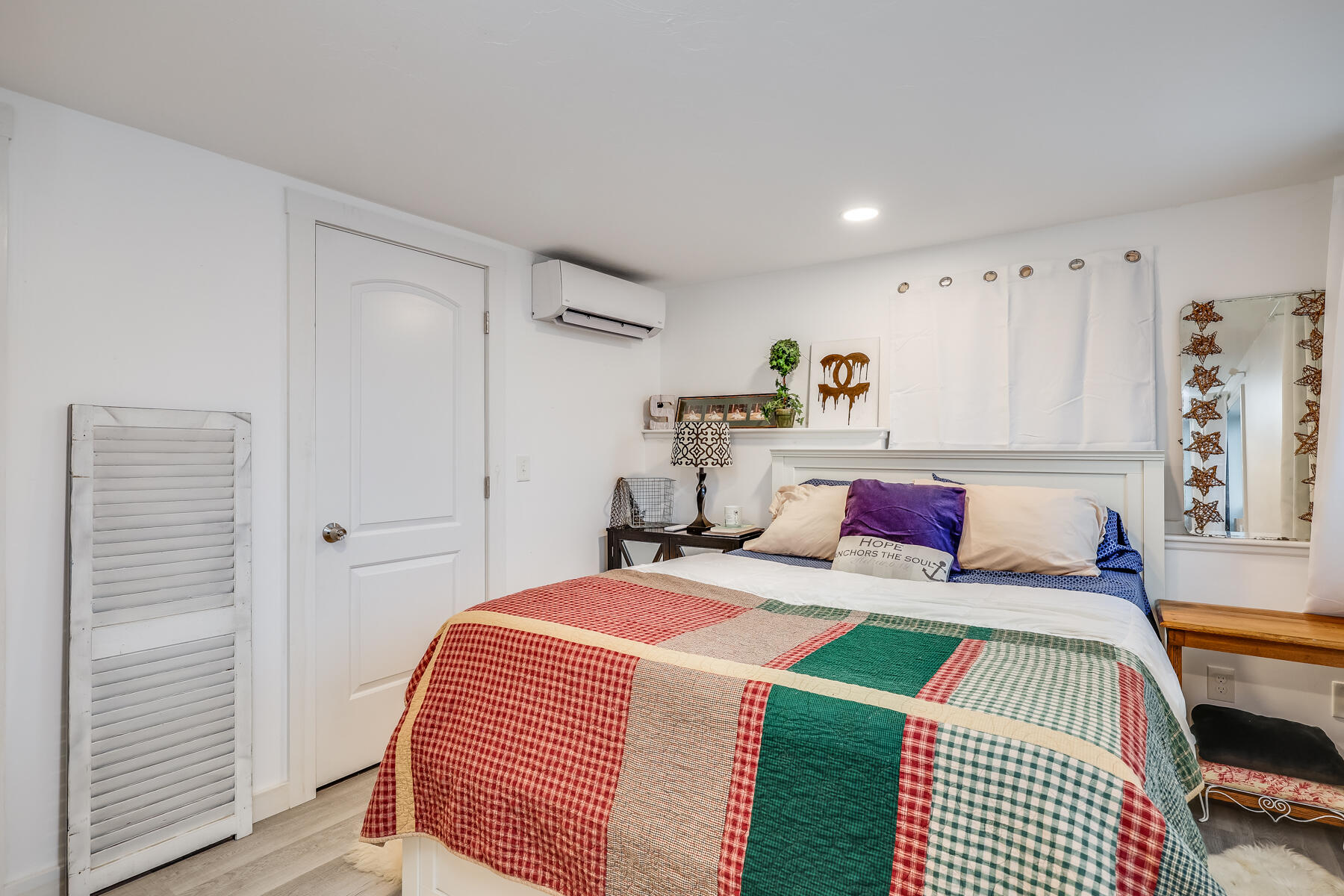 8 Green Street Buzzards Bay, MA 02532 - Photo 33 of 50 a bedroom with a bed and a painting on the wall