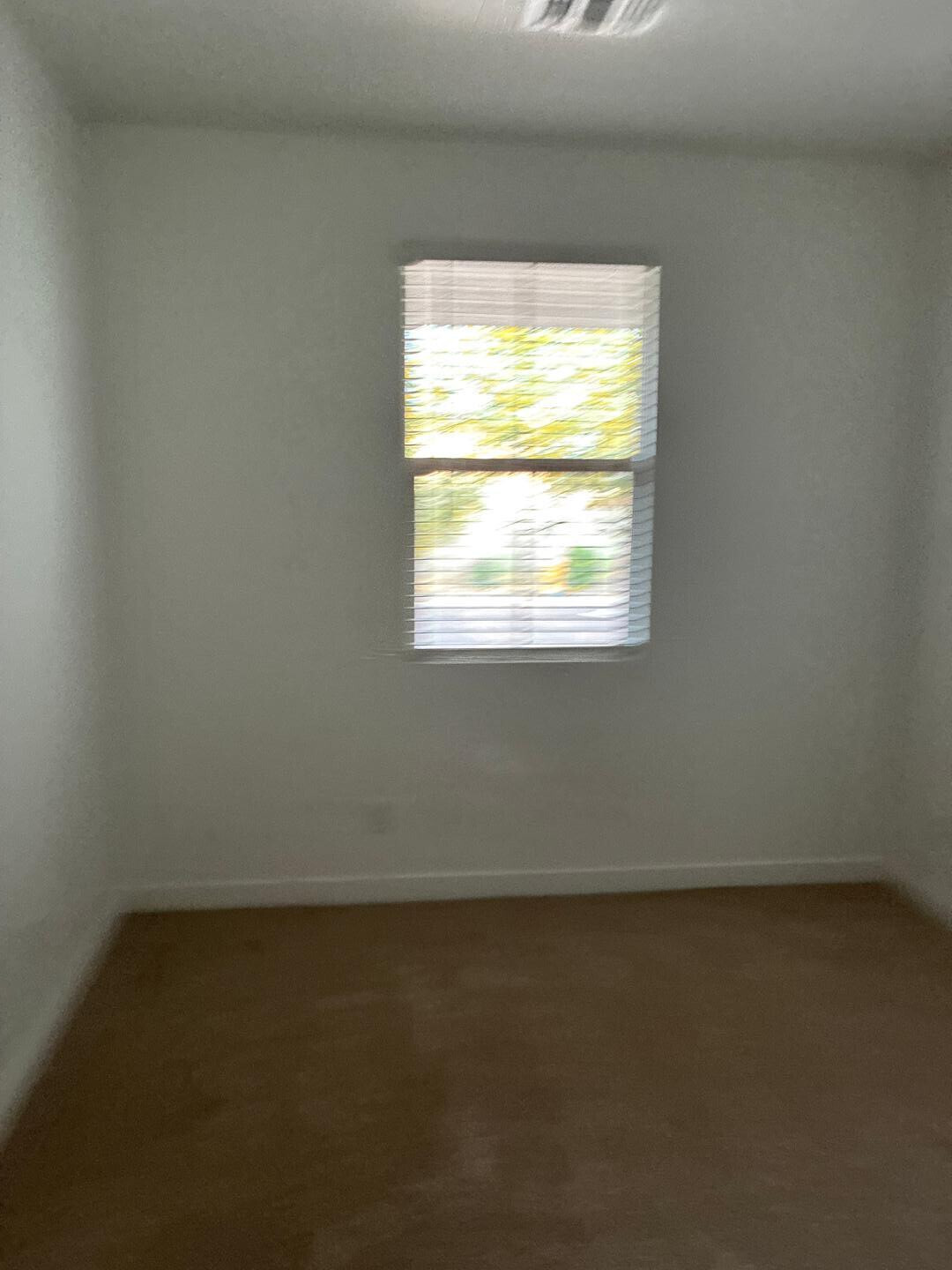 5630 South Daisy Patch Place Phoenix, AZ 85040 - Photo 6 of 14 an empty room with a window